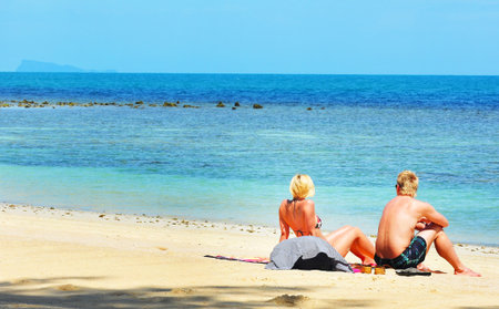 Travelers  relax on the beach ,thailandの写真素材