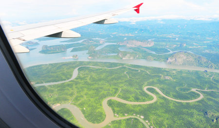 View of plane window on Thai islandsの写真素材
