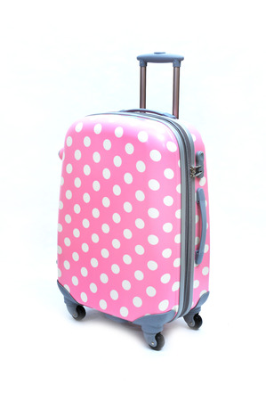 Travel luggage isolated on the white backgroundの写真素材