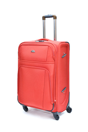 Travel luggage isolated on the white backgroundの写真素材