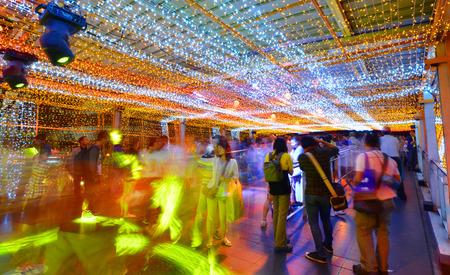 BANGKOK -Thai people walking at Thailand kingdom of light festival on BTS skywalk ratchaprasong in christmas day, on December 25, 2014 in Bangkok Thailandのeditorial素材