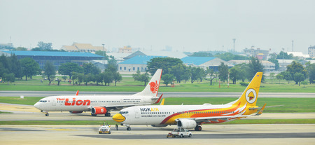 BANGKOK - April 27: Commercial aircraft wait for taking off at Don Mueang international airport on...