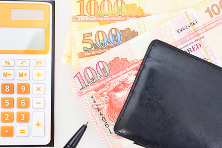 HongKong currency wallet and calculator on white background