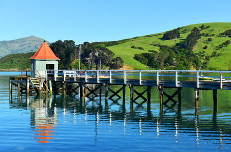 Jetty Pier of Akaroa on NOV24, 2014 in Akaroa, NZ. Akaroa is a historic French and British settlement nestled in the heart of an ancient volcano on Banks Peninsula, NZ.の写真素材