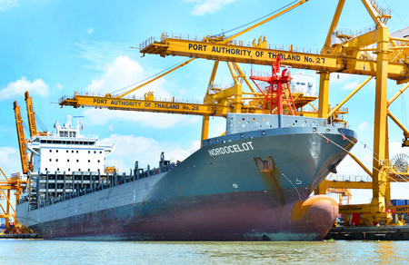 Bangkok,Thailand - June 6,2015 : Bangkok Port Authority of Thailand ,The port in Bangkok with loaded freight ship and cargo handling equipment on the side of Chao Phraya river in Bangkok,Thailand.のeditorial素材