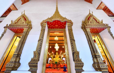 Buddha statue and monk at Wat Saket, Travel Landmark of Bangkok THAILANDのeditorial素材