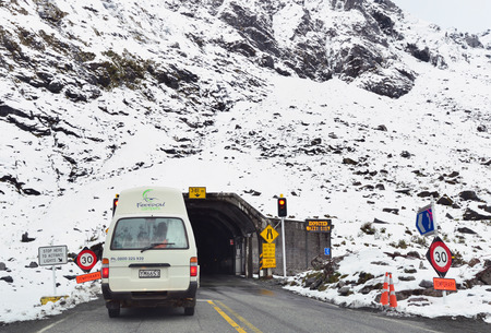 FIORDLAND,NZ - November 20 :Cars enter Homer Tunnel on Nov 20 2014.It's a 1.2km 0.75 miles road tunnel and until it was sealed and enlarged it was the longest gravel-surfaced tunnel in the world.のeditorial素材