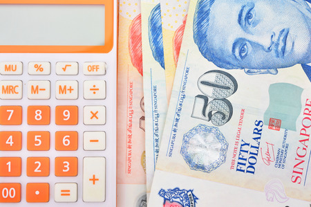 calculator and banknote singapore dollarの写真素材