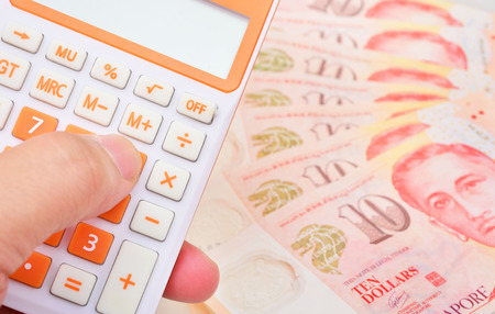 calculator and banknote singapore dollarの写真素材