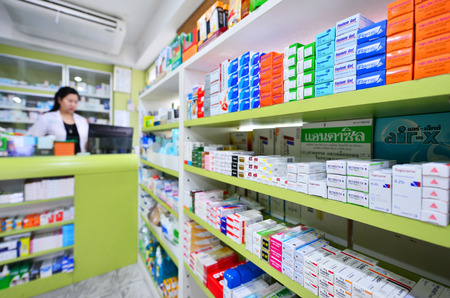 Bangkok,Thailand - JAN 9:Asian pharmacist chemist woman standing in pharmacy drugstore on JAN 9,2016 in Bangkok,Thailand.Over 12,123 pharmacy drugstore in Thailand.のeditorial素材