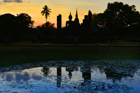 Silhouette Buddha Statue at Wat Mahathat in Sukhothai Historical Park,Thailandの写真素材