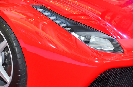 Bangkok,Thailand - JUNE 1, 2016 : headlights and wheel of ferrari on the sport car.Italian week 2016 at Central World Shopping Mall in Bangkok.のeditorial素材