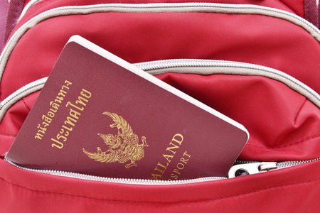 Thai Passport in red travel bag.Travel concept.の写真素材