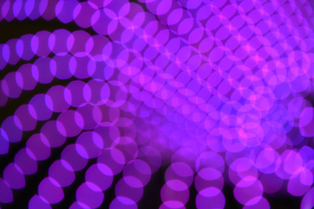 Abstract image with many purple lights. (Out of focus technique)