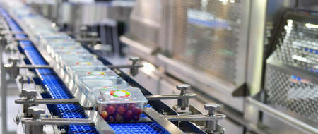 Food products boxs transfer on Automated conveyor systems industrial automation for packageの写真素材