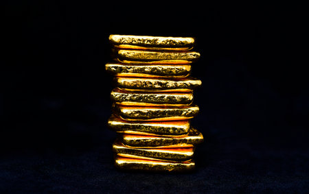 Close up photo a gold bars on black background,copy spaceの写真素材