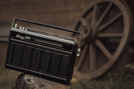 Retro radio receiver background on the wheels of carts