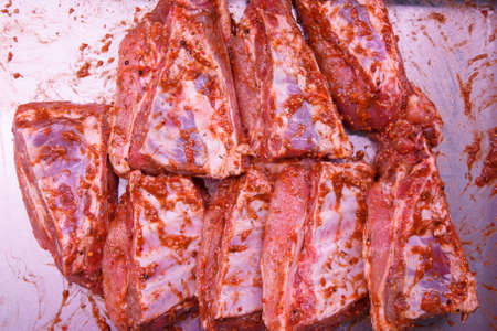 Pork ribs in the marinade and spices macroの写真素材