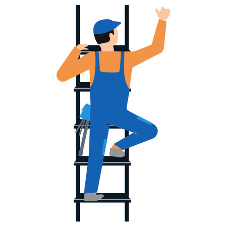 Worker in construction overalls climbs a ladderの写真素材