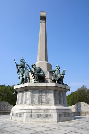 Bronze Statues on War Memorial against a blue sky, Port Sunlight, Merseyside, England の写真素材