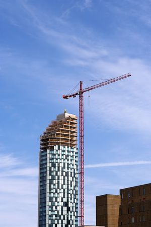 Construction Crane Against a Blue Skyの写真素材