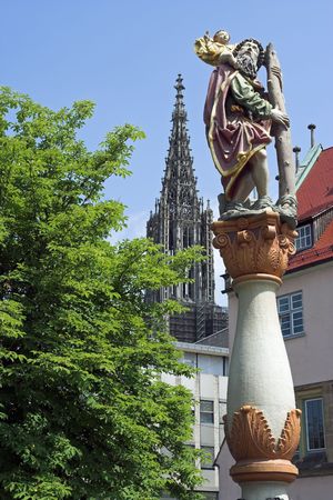 Ulm Minster spire with St Christopher Statue (1584) foreground, Germanyの写真素材