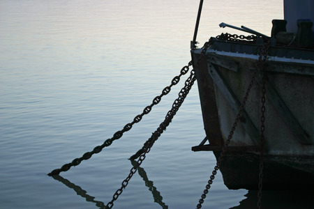 Anchor chains hanging from boatの写真素材