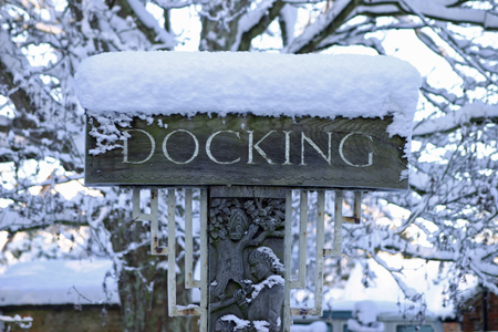 Docking Village Sign In Snowの写真素材