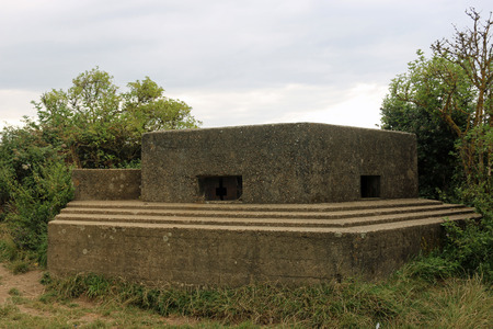 An FW3/22 type world war two pillbox on the east coast of England with two loopholes and surrounded...