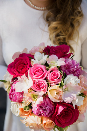 the bride holding a wedding bouquetの写真素材
