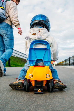 Mom with a child playing in the streetの写真素材