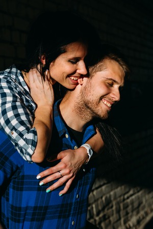 pair show each other a sense of passing on the streetの写真素材