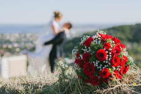 couple posing for photos on a sunny day