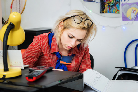 woman editor checks the magazine and newspaperの写真素材