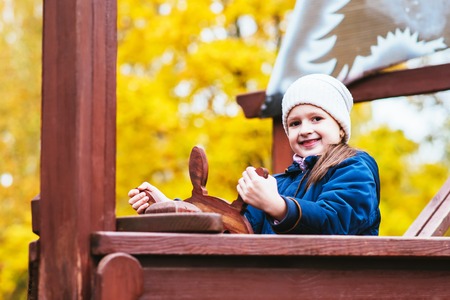 beautiful girl at the helm of the ship in the Parkの写真素材