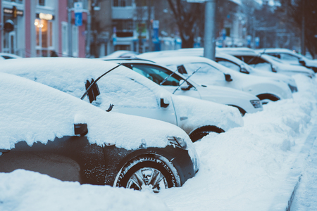 cars in the Parking lot are all in the snowの写真素材