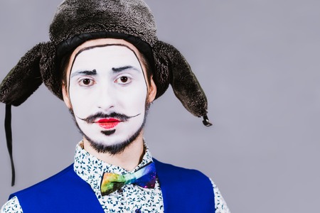 Mime poses and grimaces in the studioの写真素材