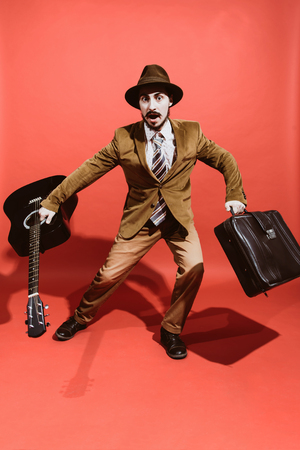 positive guy playing the guitar and posingの写真素材