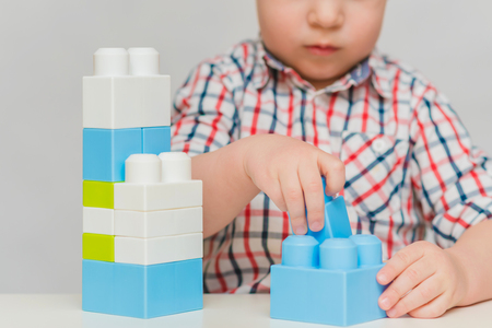 the kid plays with the designer at homeの写真素材