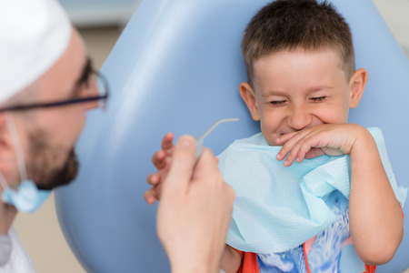 doctor orthodontist playing with the boy in the dental office.の写真素材