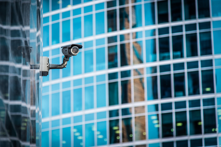 surveillance camera attached to the wall of the houseの写真素材