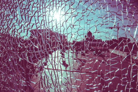 view through cracked glass on a sunny day in Moscowの写真素材