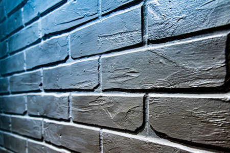 part of the brickwork of the house is painted blue