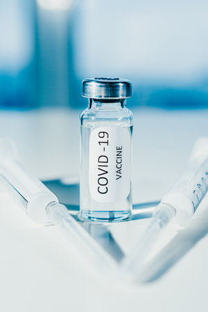 Vaccination against coronavirus COVID-19. Ampoule and syringe close-up. Conceptの写真素材