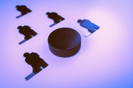 Hockey players team and puck on a blue background.