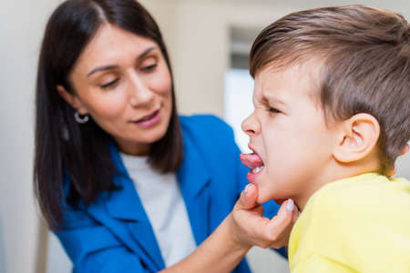 A beautiful woman speech therapist deals with the boy and teaches him the correct pronunciation and...