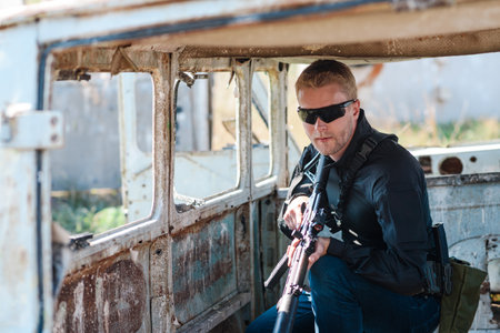 A man with a machine gun in his hand undergoes military training and learns to shoot at the firing...