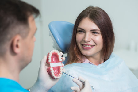 the doctor explains to the patient how the braces are arrangedの写真素材