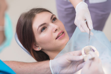 the doctor explains to the patient how he will treat herの写真素材