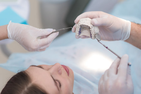 the doctor explains to the patient how he will treat herの写真素材